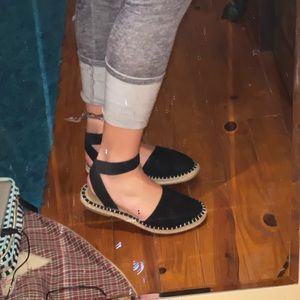 Black strapped sandal.